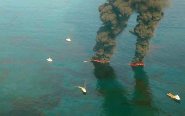 Coast Guard photograph showing surface oil and vessels engaged in controlled burns in aftermath of the oil spill. (U.S. Coast Guard) Coast Guard photograph showing surface oil and vessels engaged in controlled burns in aftermath of the oil spill. (U.S. Coast Guard)